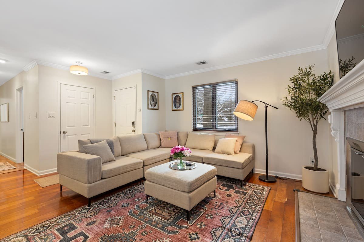 The Little Blue House living room with a sectional and fireplace